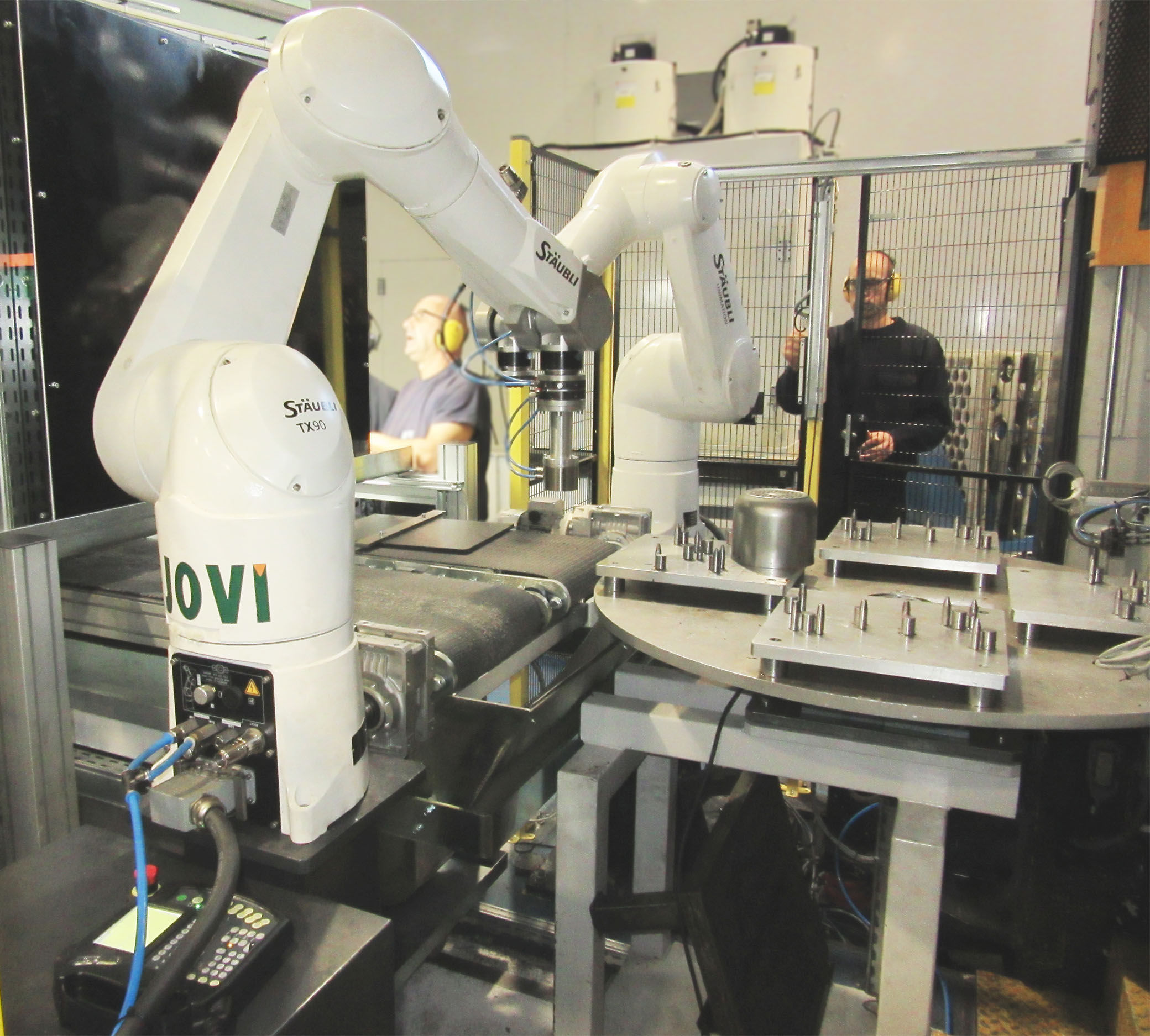 Robots y máquinaria a medida para alimentación y posicionamiento de piezas industriales